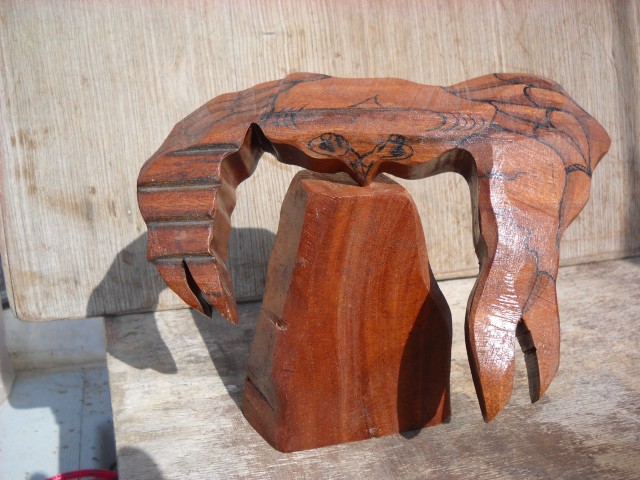 a balncing crab made out of wood